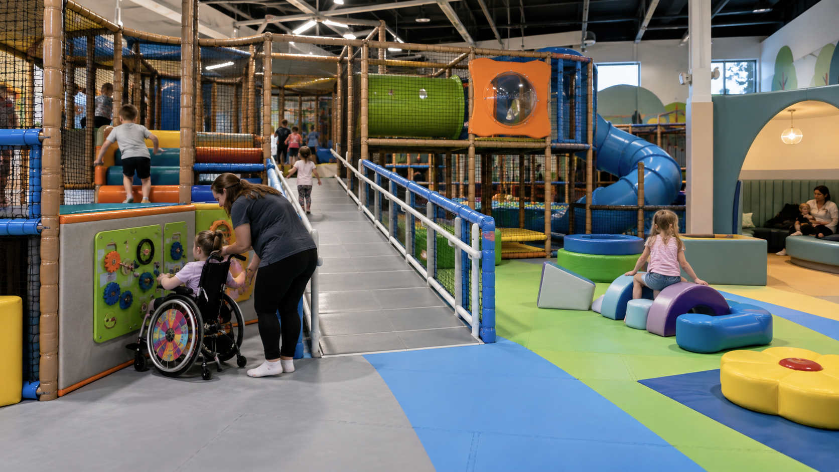 Accessible indoor amusement park with soft play structures and children
